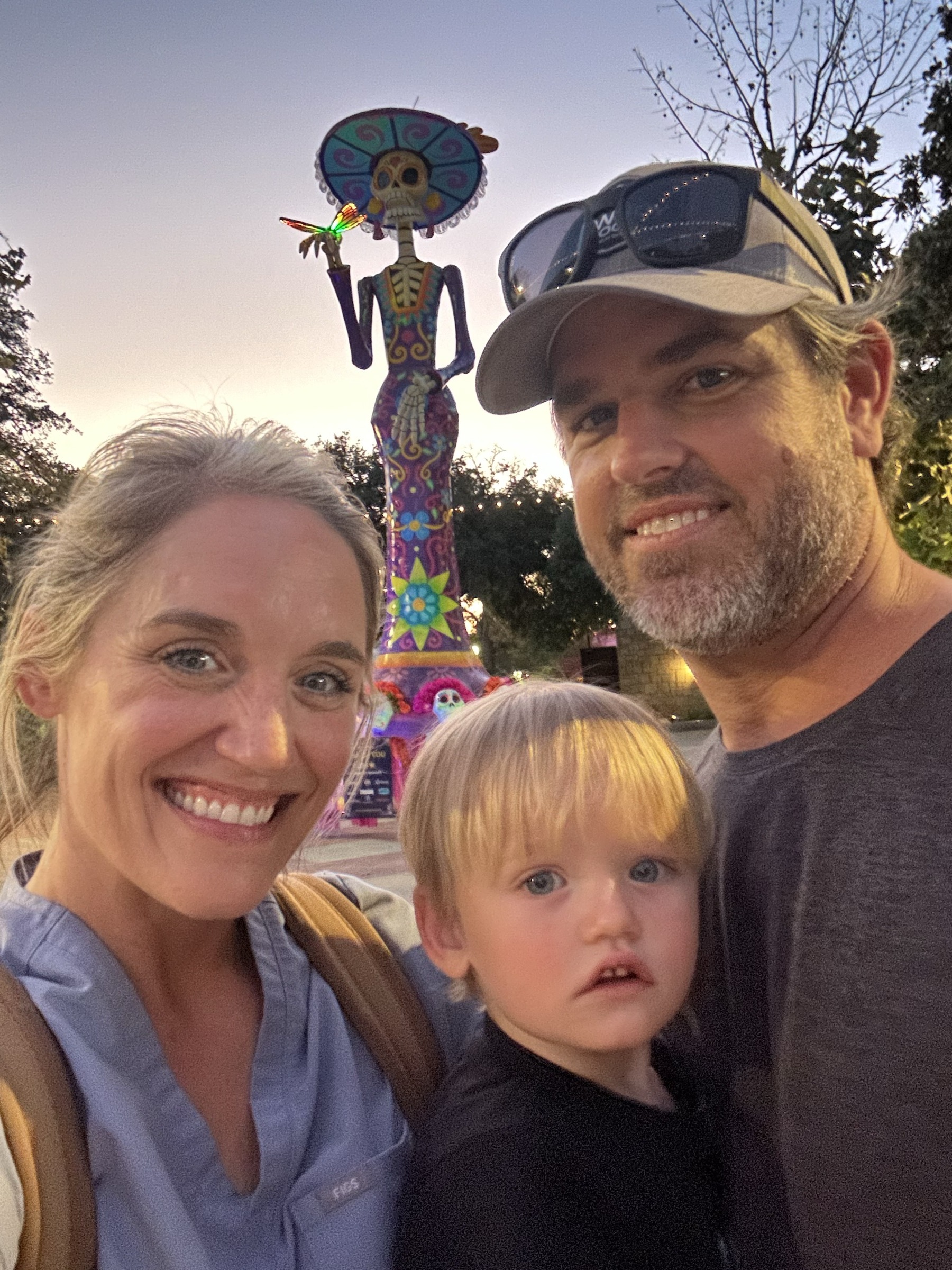 Family at the Catrina sculpture during Day of the Dead in San Antonio